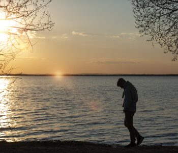 sad-contemplative-person-near-lake